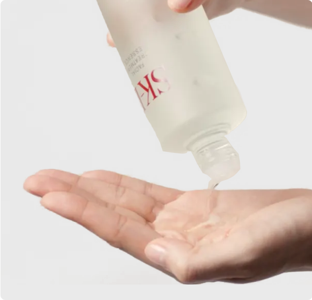 sk-ii essence pouring on hand